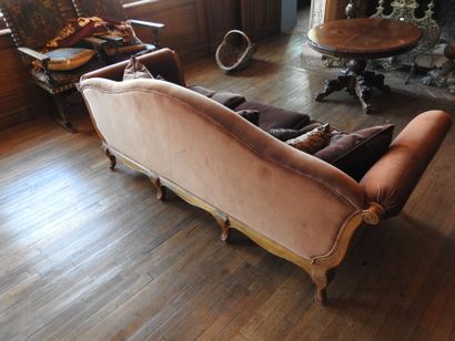 Carved oak three-seater sofa on eight legs....