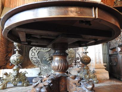 Carved oak oval middle table resting on four...