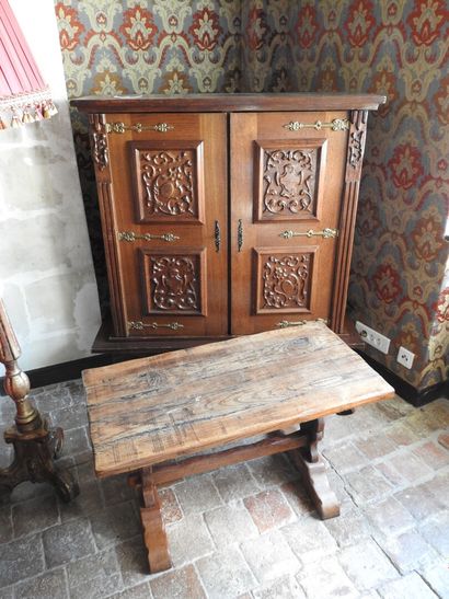 Small bookcase opening with two doors and...