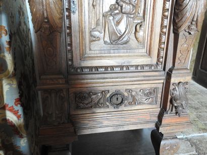 Carved wood cabinet with two doors and a...