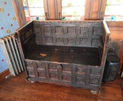 Church bench forming a chest in wood carved...