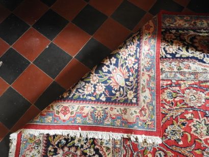 Polychrome wool hand-knotted rug decorated...
