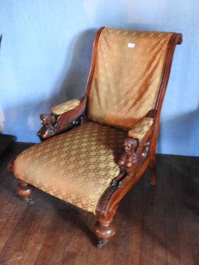 Carved mahogany armchair, sphinx-shaped armrests,...