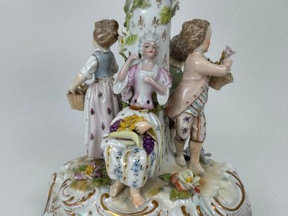 A polychrome and gold porcelain bowl decorated...