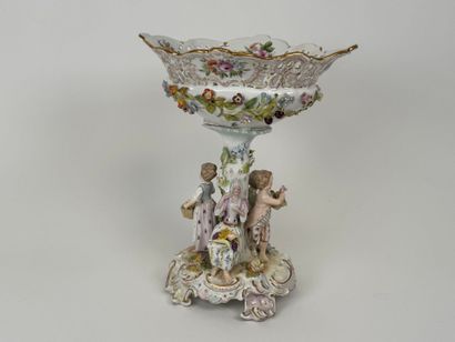 A polychrome and gold porcelain bowl decorated...