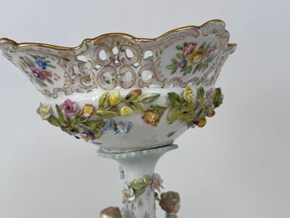 A polychrome and gold porcelain bowl decorated...