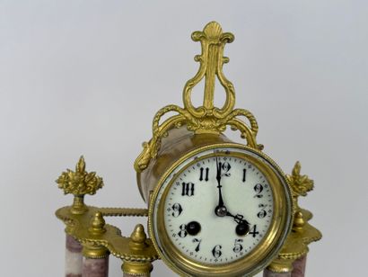 Column clock in veined marble and gilded...