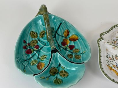 Two polychrome earthenware beggars, one decorated...
