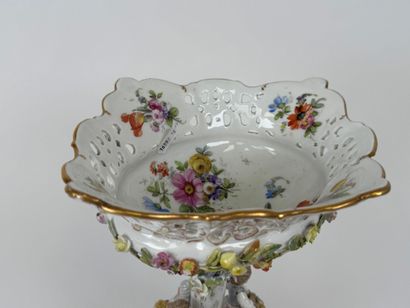 A polychrome and gold porcelain bowl decorated...