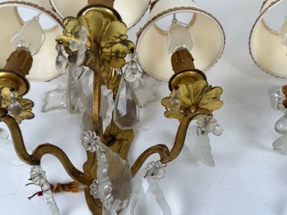 Pair of ormolu sconces with three light arms...