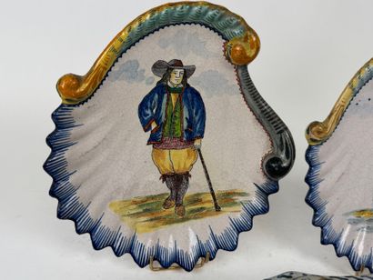 Polychrome and gold earthenware lot including:
-...