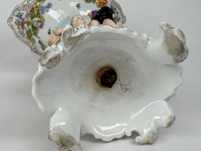 A polychrome and gold porcelain bowl decorated...