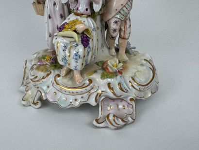 A polychrome and gold porcelain bowl decorated...