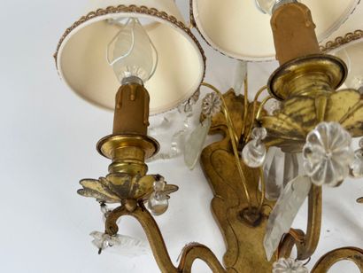 Pair of ormolu sconces with three light arms...