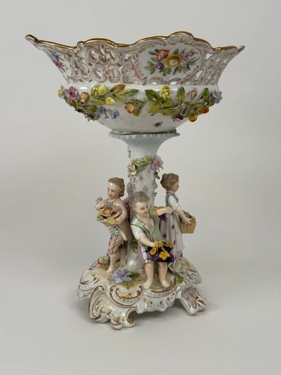 A polychrome and gold porcelain bowl decorated...