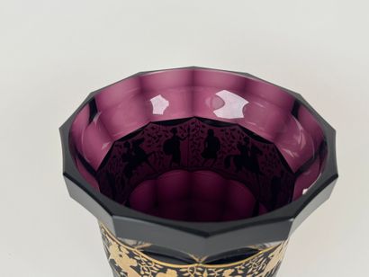 Colored glass vase with cut sides, decorated...