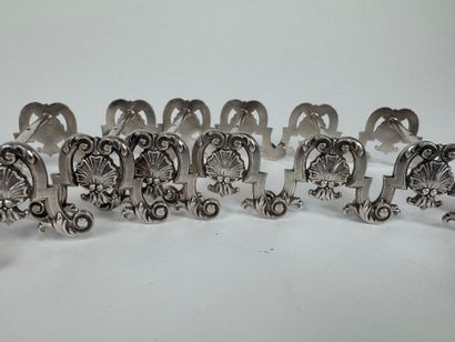 Suite of 12 silver-plated knife holders decorated...