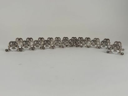 Suite of 12 silver-plated knife holders decorated...