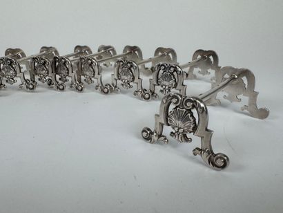 Suite of 12 silver-plated knife holders decorated...