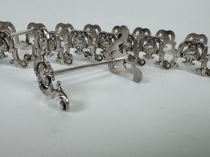 Suite of 12 silver-plated knife holders decorated...