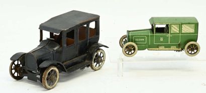Two sheet-metal cars in need of cleaning:
...