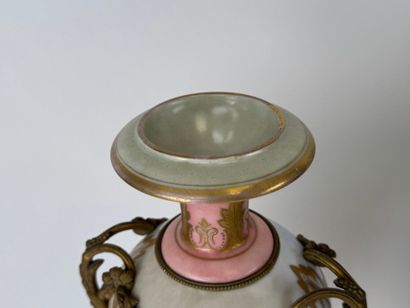 A large polychrome and gold porcelain vase...