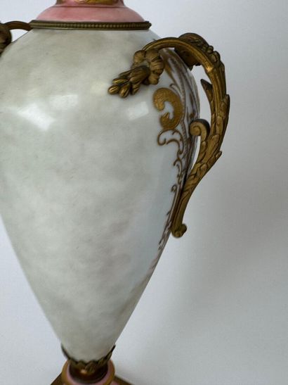 A large polychrome and gold porcelain vase...