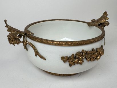 A small white porcelain bowl, with two chased...