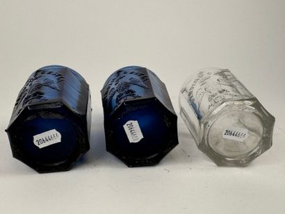 Three glasses, two of which are colored with...