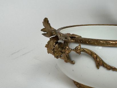 A small white porcelain bowl, with two chased...