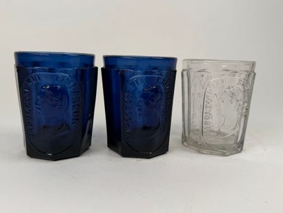 Three glasses, two of which are colored with...