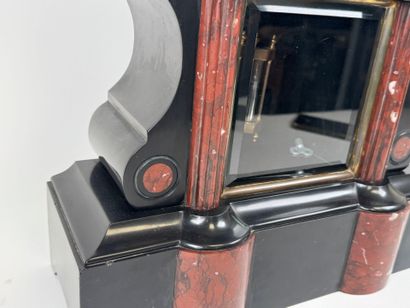 Black and polychrome marble clock featuring...