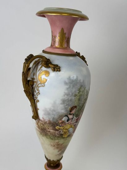 A large polychrome and gold porcelain vase...