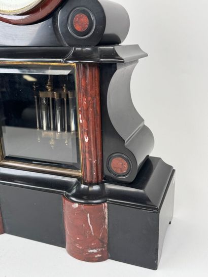 Black and polychrome marble clock featuring...