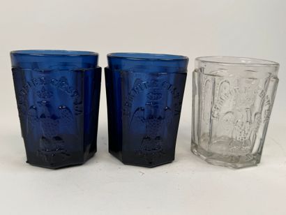 Three glasses, two of which are colored with...
