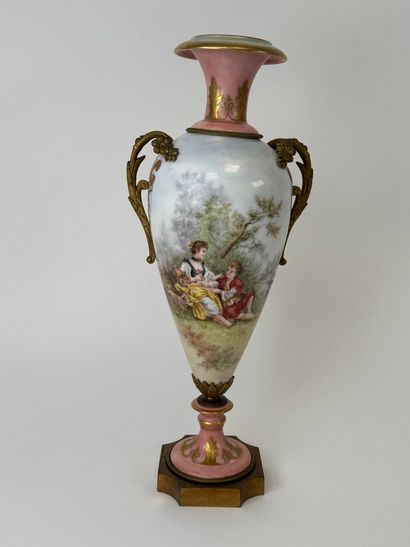 A large polychrome and gold porcelain vase...