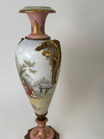 A large polychrome and gold porcelain vase...