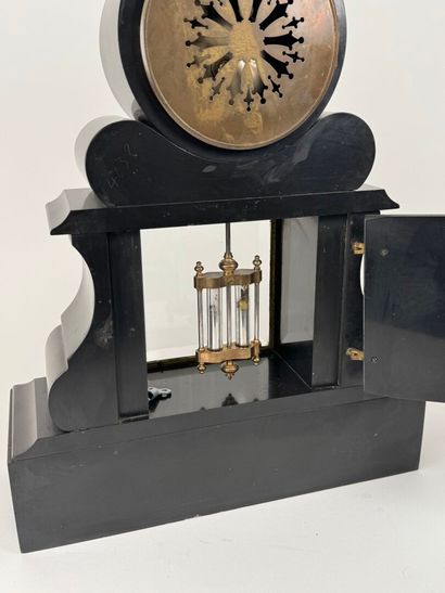 Black and polychrome marble clock featuring...