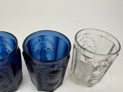 Three glasses, two of which are colored with...