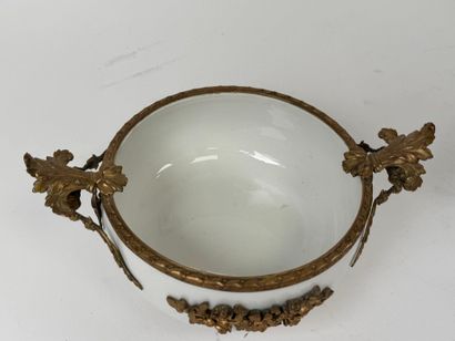 A small white porcelain bowl, with two chased...