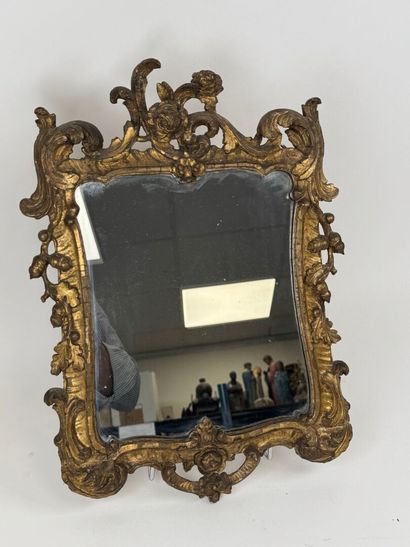 Small mirror in wood and gilded stucco, with...
