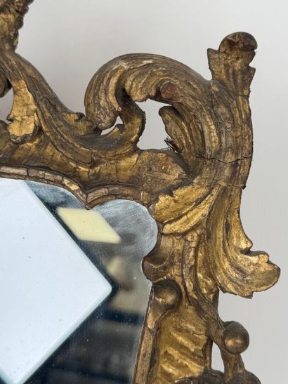 Small mirror in wood and gilded stucco, with...
