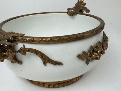 A small white porcelain bowl, with two chased...