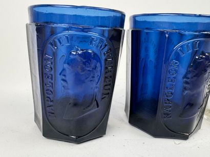 Three glasses, two of which are colored with...
