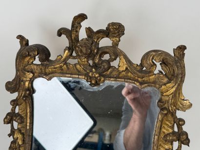 Small mirror in wood and gilded stucco, with...