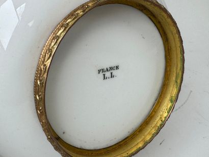A small white porcelain bowl, with two chased...
