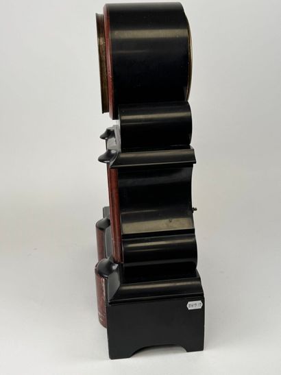 Black and polychrome marble clock featuring...