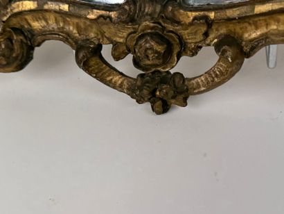 Small mirror in wood and gilded stucco, with...