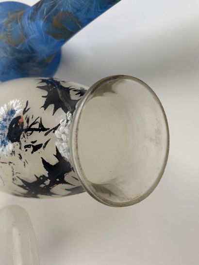 Three glass vases, one painted with flowers,...