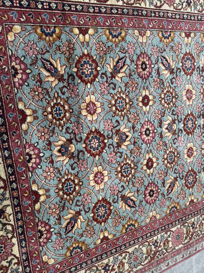 Polychrome wool carpet with floral motifs....
